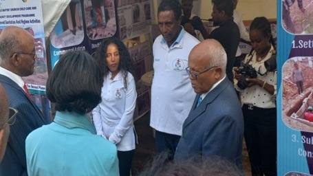 Officials being shown the market-based sanitation stand at the national development award event
