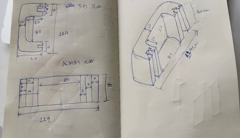 Notebook sketch of an interlocking precast panel, drawn in plan, elevation and 3D with dimensions in centimetres