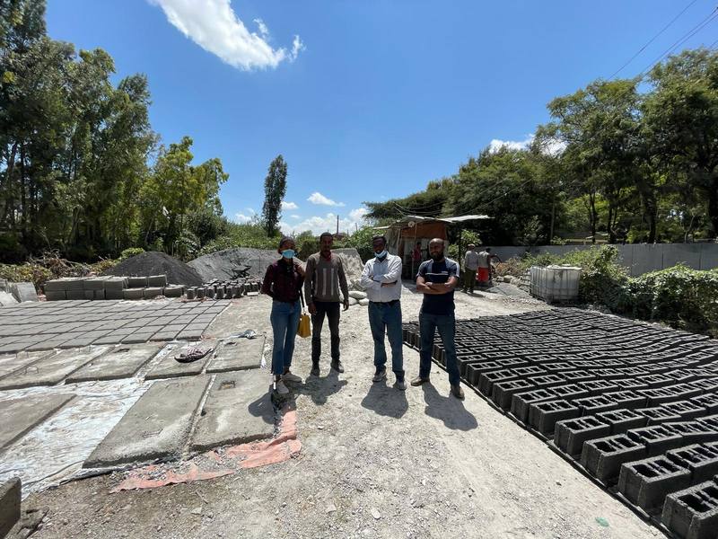 Precast slabs and interlocking blocks curing at a local production yard
